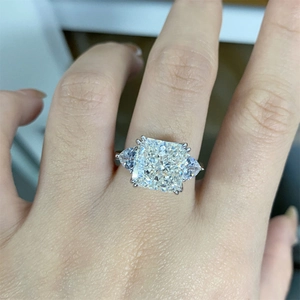 Macro shot of S925 silver ring featuring square cushion cut and side pear stones
