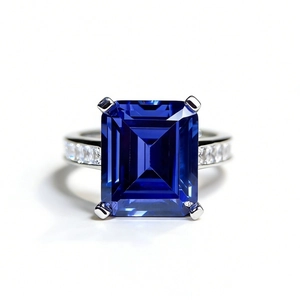 Classic 925 sterling silver ring with emerald-cut blue stone and side diamonds
