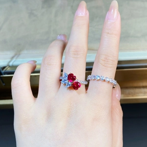 Detail of S925 silver rings with heart-shaped red stones and marquise-cut accents