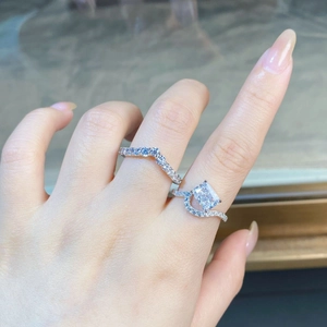 Close-up of S925 silver ring set with 2-carat rectangular diamond and V-shaped band