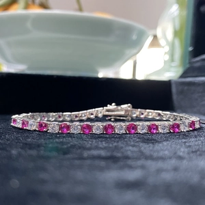 S925 sterling silver tennis bracelet with alternating red and white cubic zirconia stones