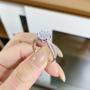 S925 silver moissanite ring with six-prong setting and pavé twisted band on hand