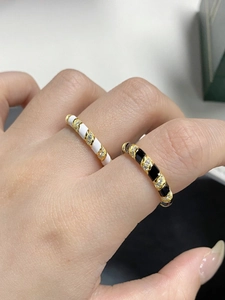 Macro shot of S925 sterling silver enamel twist rings with gold plating and zircons