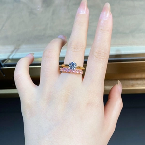 Detail of 18K gold S925 silver ring set with 1ct moissanite and pink accent stones