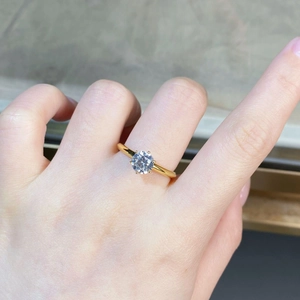 Close-up of a 18K gold plated S925 silver ring featuring a six-prong moissanite stone