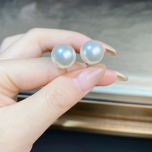 Minimalist S925 sterling silver stud earrings featuring large white round pearls