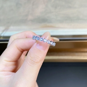 Close-up of S925 sterling silver heart-shaped eternity ring with shimmering pavé diamonds
