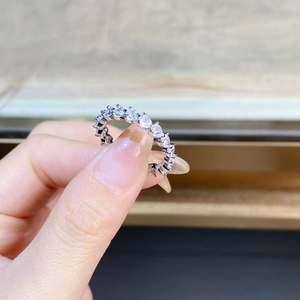 Detailed view of silver S925 heart-shaped sparkling eternity ring with micro-pave diamonds