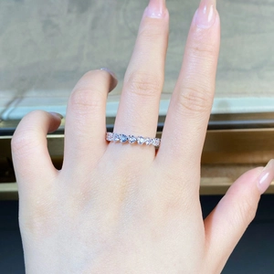 Close-up of S925 sterling silver ring with heart-cut cubic zirconia in a paved setting