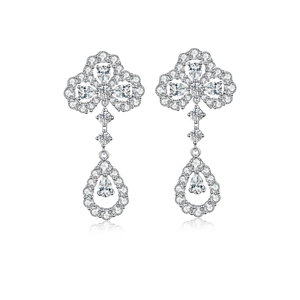 Macro view of S925 sterling silver clover earrings with teardrop zircon fringe details