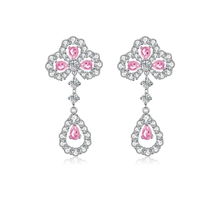 Macro view of S925 sterling silver clover drop earrings with pink pear-cut gemstones