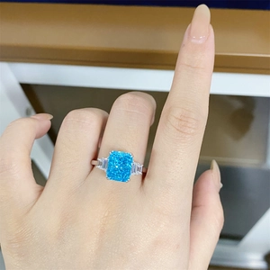 Close-up of S925 silver ring with 4-carat blue aquamarine and rectangular side stones