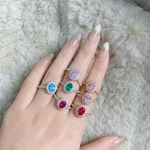 Macro detail of classic S925 sterling silver four-prong rings with colorful oval zirconias