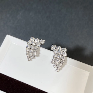Close-up of S925 sterling silver wing earrings with sparkling zircon tassel detail