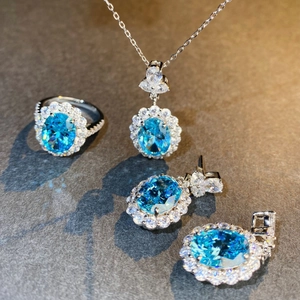 Parure de bijoux de luxe en argent S925 avec pierres bleues ovales et halos étincelants