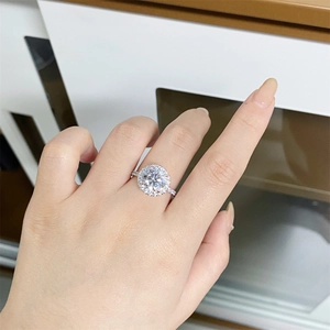 Classic 925 sterling silver moissanite ring shown worn on hand with round brilliant cut