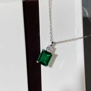 Elegant S925 sterling silver necklace with emerald cut green gemstone and round accents