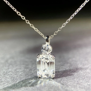 S925 sterling silver necklace featuring emerald cut clear gemstone pendant on stone base