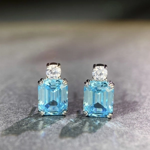 Elegant S925 sterling silver earrings featuring emerald cut blue aquamarine gemstones