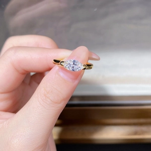 Elegant 925 sterling silver marquise cut moissanite ring with a polished gold finish