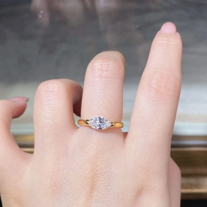 Macro view of marquise-cut mint green gemstone ring in gold plated sterling silver
