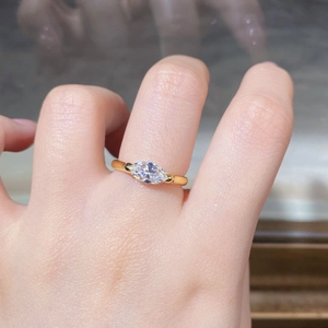 Detail of 925 silver marquise-cut mint green stone ring worn on a finger