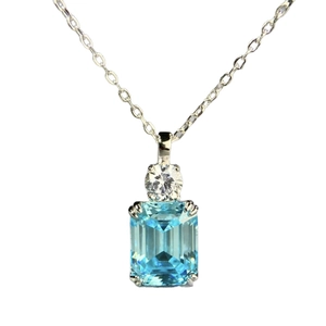 S925 silver necklace featuring an emerald cut aquamarine blue zircon pendant on white background