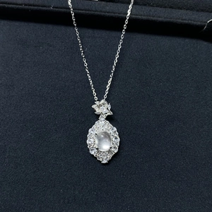 Detailed macro view of S925 sterling silver necklace with ice oval gemstone and diamonds