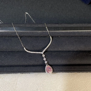 Detailed close-up of pink pear-cut gemstone pendant necklace in 925 sterling silver