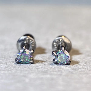 Detailed close-up of S925 sterling silver dragon claw stud earrings with aurora zircons