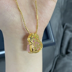 S925 sterling silver gold necklace with a pink crystal pendant in a hollow heart cage