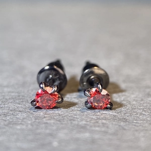 Macro shot of red gemstone earrings featuring black dragon claw settings in S925 silver