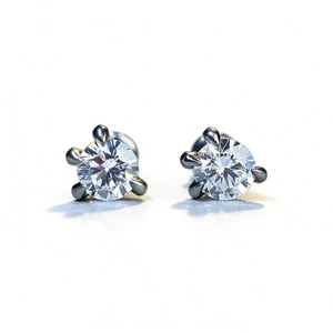 Classic silver dragon-claw stud earrings with round brilliant-cut sparkling moissanite stones