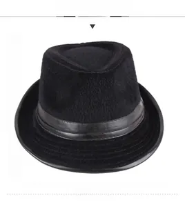 Close-up of a black faux fur fedora hat featuring a stylish leather decorative band