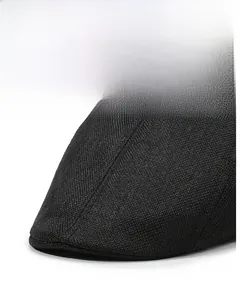 Macro detail of the stiff brim and breathable linen weave on this black beret cap