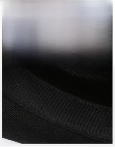 Detail view of the wide sweatband with breathable mesh texture on the black summer sun hat