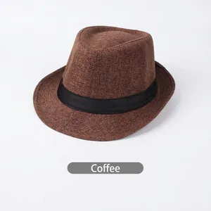 Macro shot of breathable linen coffee brown fedora hat with a black decorative ribbon