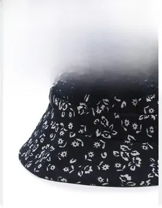 Detailed close-up of dark blue floral sun hat brim showing precise stitching and shape