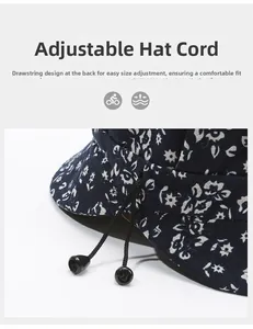 Detail view of the adjustable drawstring with black toggles on the floral sun hat