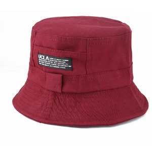 Detail of burgundy cotton bucket hat featuring UCLA patch and precise brim stitching
