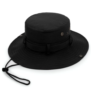 Macro shot of black wide brim boonie hat featuring metal eyelets and adjustable chin strap