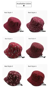 Detail view of red floral cotton bucket hats with adjustable drawstrings in six patterns