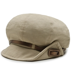 Women's beige striped newsboy cap with brown leather strap and metal buckle accent