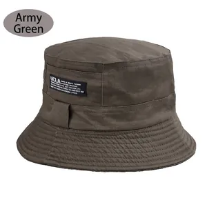 Close-up of military green cotton bucket hat featuring UCLA fabric label and stitching