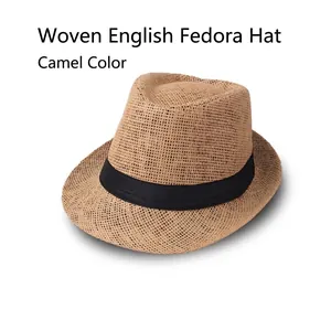 Detail of camel linen fedora hat featuring a classic black ribbon and breathable texture