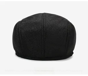 Rear view detail of black linen newsboy cap showing breathable mesh and stitching