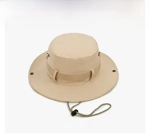 Detail of beige outdoor bucket hat featuring metal vents and adjustable windproof cord