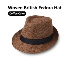 Close-up of coffee brown woven straw jazz hat with black ribbon and fine texture
