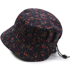 Detail of floral bucket hat with adjustable black elastic drawstring and soft cotton texture