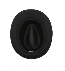 Detailed interior view of a black sun hat featuring the inner sweatband and product label